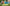 Children playing soccer on a field with aftercare advertisement text overlay.